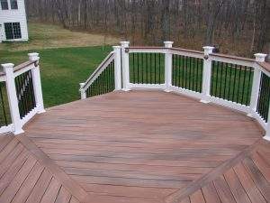 large deck area with fence and stairs