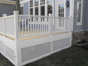Close view of white deck in front of the house.