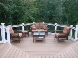 A beautiful new deck installed by Builders Fence Company, featuring a matching furniture set